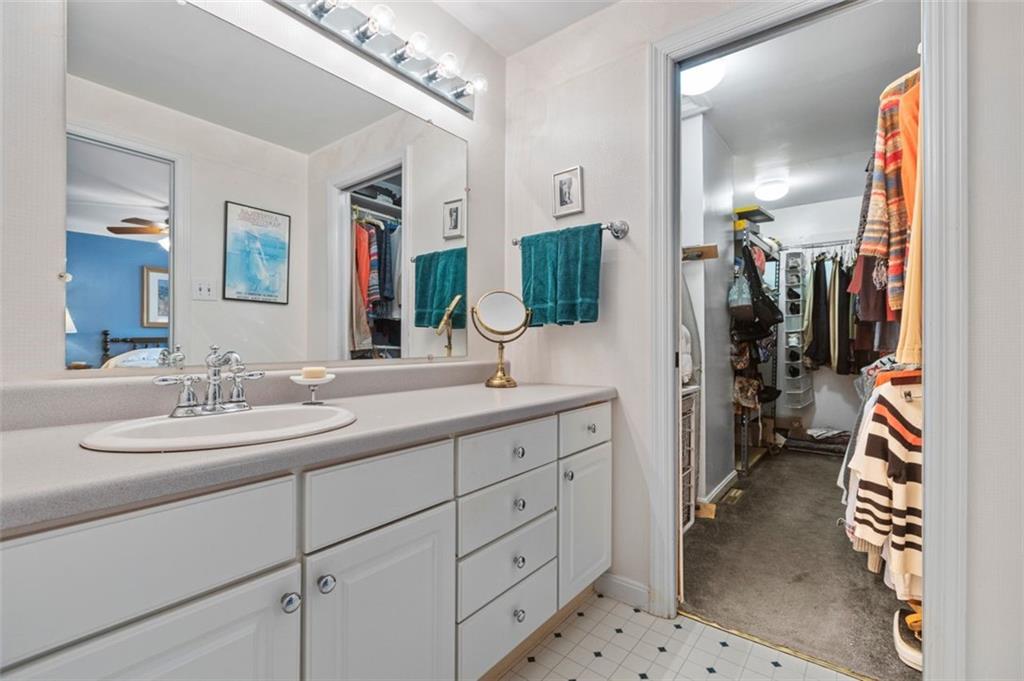 1573 Pineview Drive Pittsburgh, PA 15241 - Photo 19 of 21 a en suite bathroom with a double vanity sink a mirror and a shower