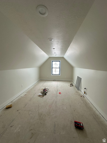 143 South Chamberlain Street, Unit 327 Mapleton, UT 84664 - Photo 9 of 12 Additional living space with a textured ceiling and baseboards