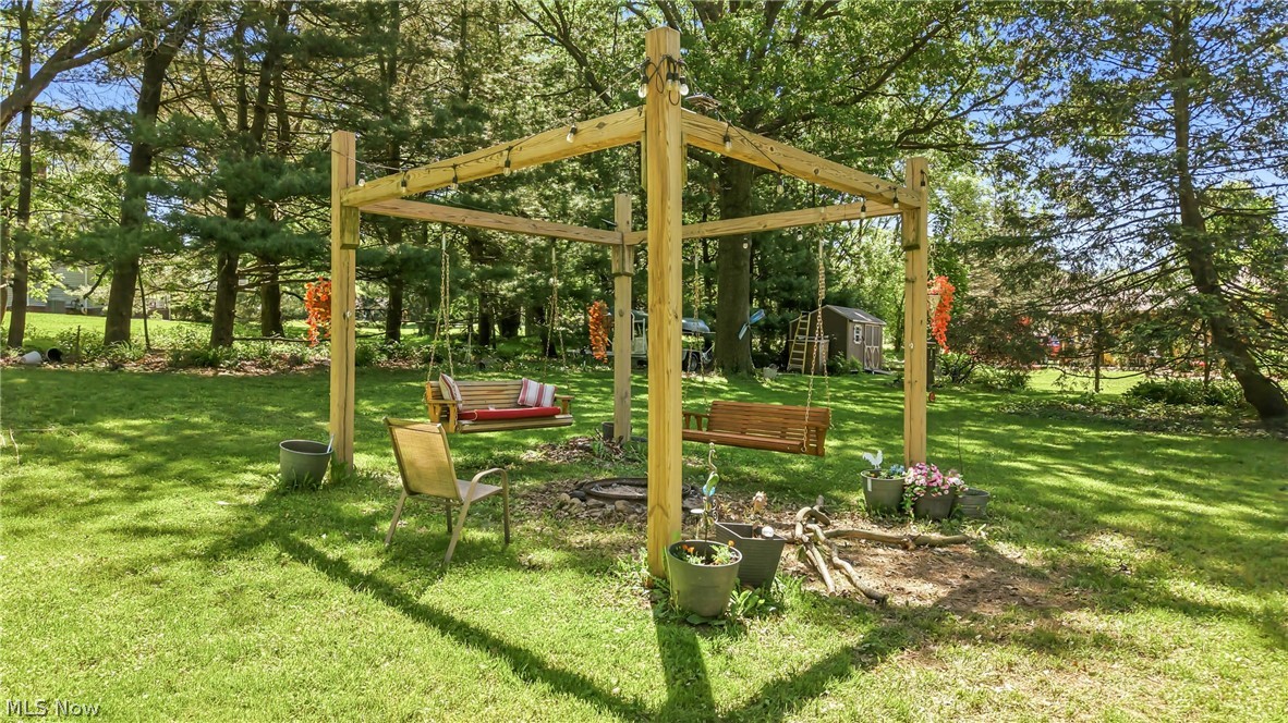 6127 Columbus Road Northeast Louisville, OH 44641 - Photo 37 of 49 Custom built pergola and fire pit