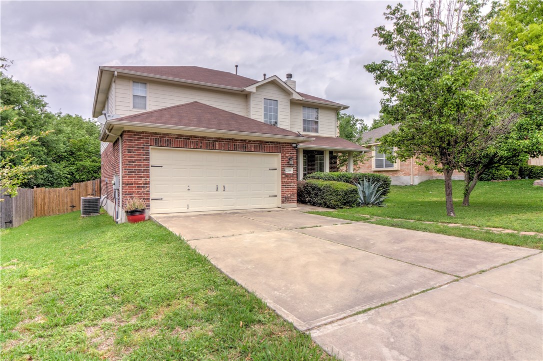 2339 Candle Ridge Trail Georgetown, TX 78626 - Photo 1 of 1 a front view of a house with a yard and garage