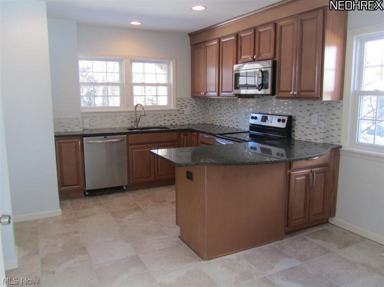 2610 Kerwick Road Cleveland, OH 44118 - Photo 6 of 23 Spacious eat-in kitchen was totally remodeled in 2013 and features a granite breakfast bar.
