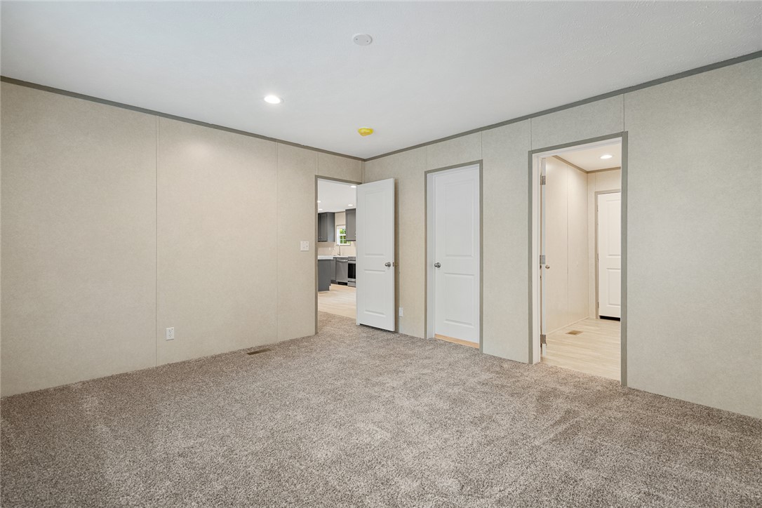 419 Austin Drive Anderson, SC 29624 - Photo 22 of 36 This versatile room features plush carpeting and multiple doorways, offering seamless flow to other living areas.