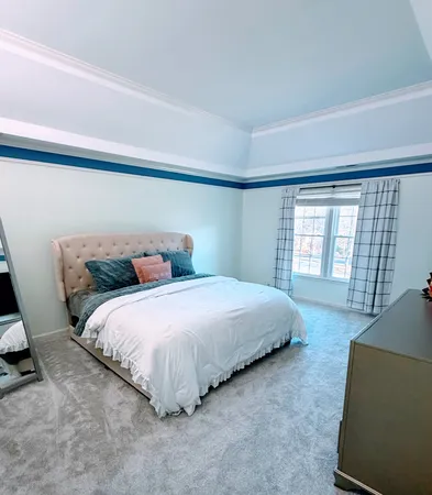a bedroom with a bed and a couch