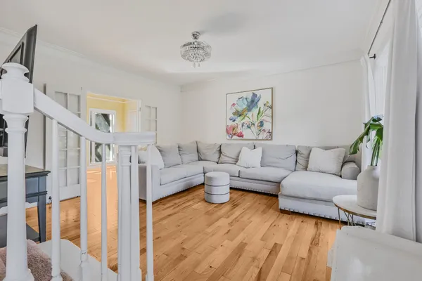 a living room with furniture and a rug