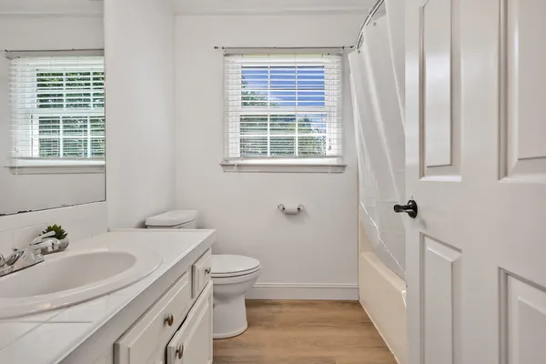 a bathroom with a sink toilet and tub