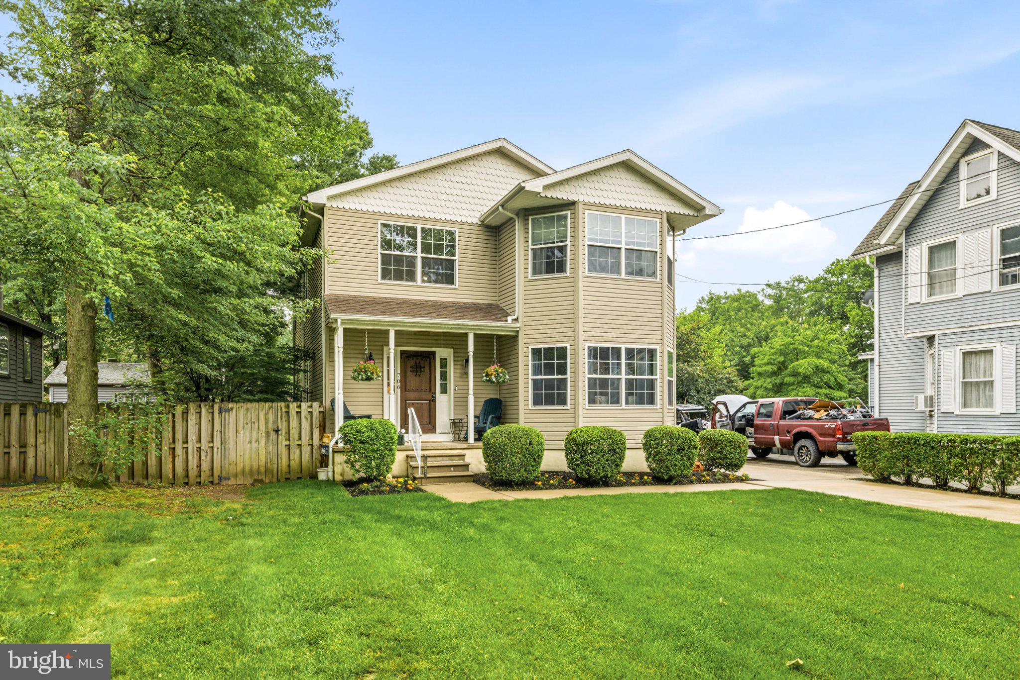 706 Main Street Riverton, NJ 08077 - Photo 2 of 44 Charming home with lush green lawn.