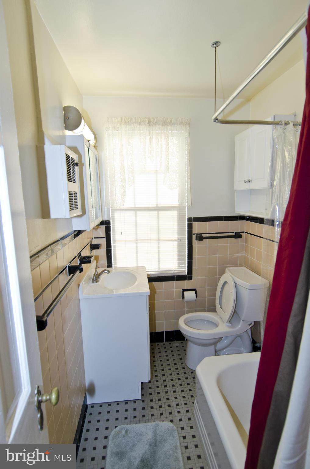 211 East Glebe Road, Unit B Alexandria, VA 22305 - Photo 11 of 15 a bathroom with a sink toilet and window