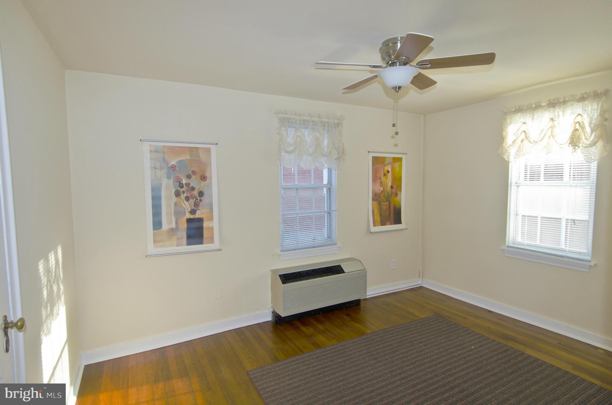 211 East Glebe Road, Unit B Alexandria, VA 22305 - Photo 9 of 15 a view of livingroom with hardwood floor and ceiling fan