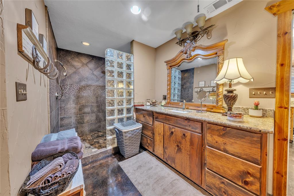 209 Dixie Road Millsap, TX 76066 - Photo 31 of 31 a spacious bathroom with a sink a vanity and a mirror