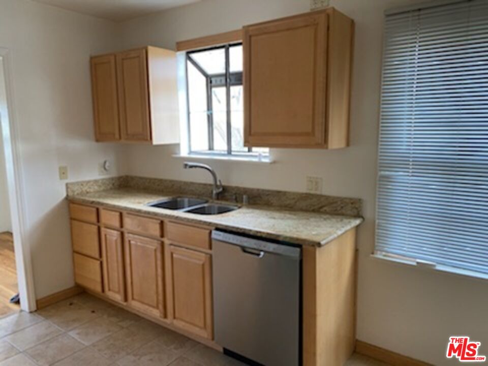 17600 Calvert Street Encino, CA 91316 - Photo 19 of 21 a kitchen with a sink and a window