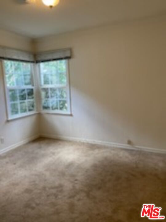 17600 Calvert Street Encino, CA 91316 - Photo 7 of 21 a view of an empty room with a window