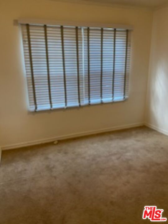 17600 Calvert Street Encino, CA 91316 - Photo 8 of 21 an empty room with a window