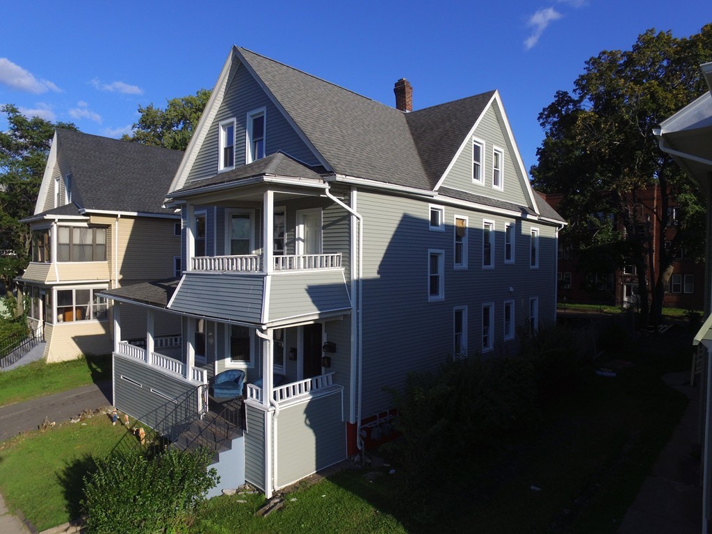 9 Leete Street Springfield, MA 01108 - Photo 2 of 23 a front view of a house with a yard