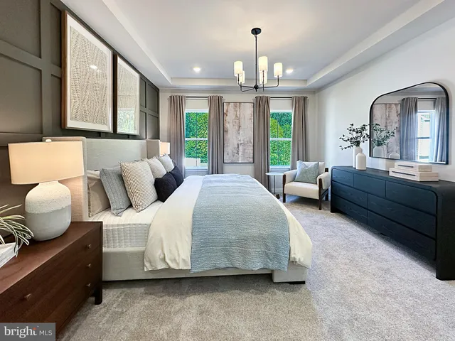 a bedroom with bed and window