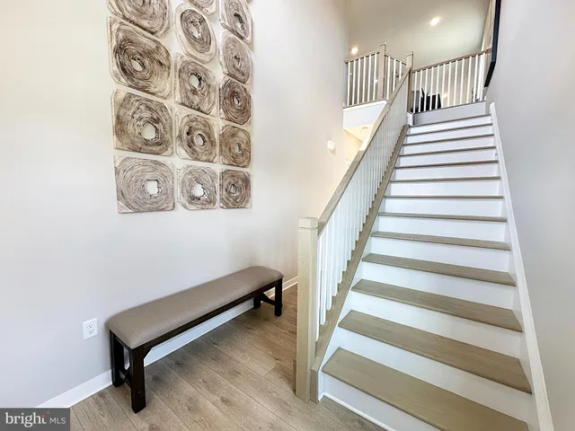 a view of staircase with white walls