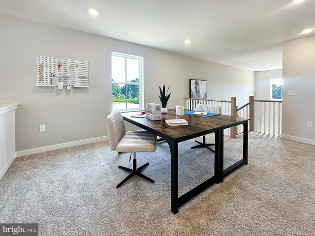 a view of a workspace with furniture