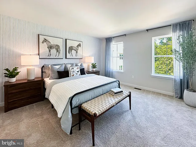 a spacious bedroom with a bed and a window