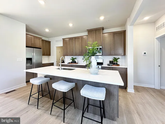 a kitchen with a table and chairs in it