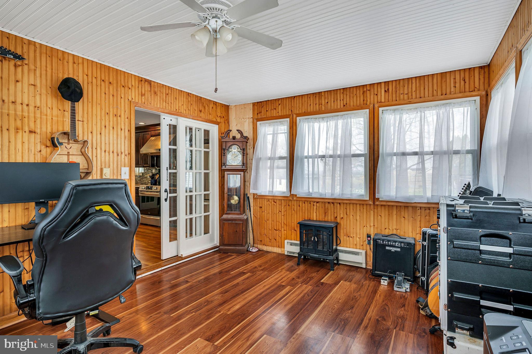 2707 Broder Street Southwest Allentown, PA 18103 - Photo 11 of 32 a view of a livingroom with furniture hardwood floor and a ceiling fan