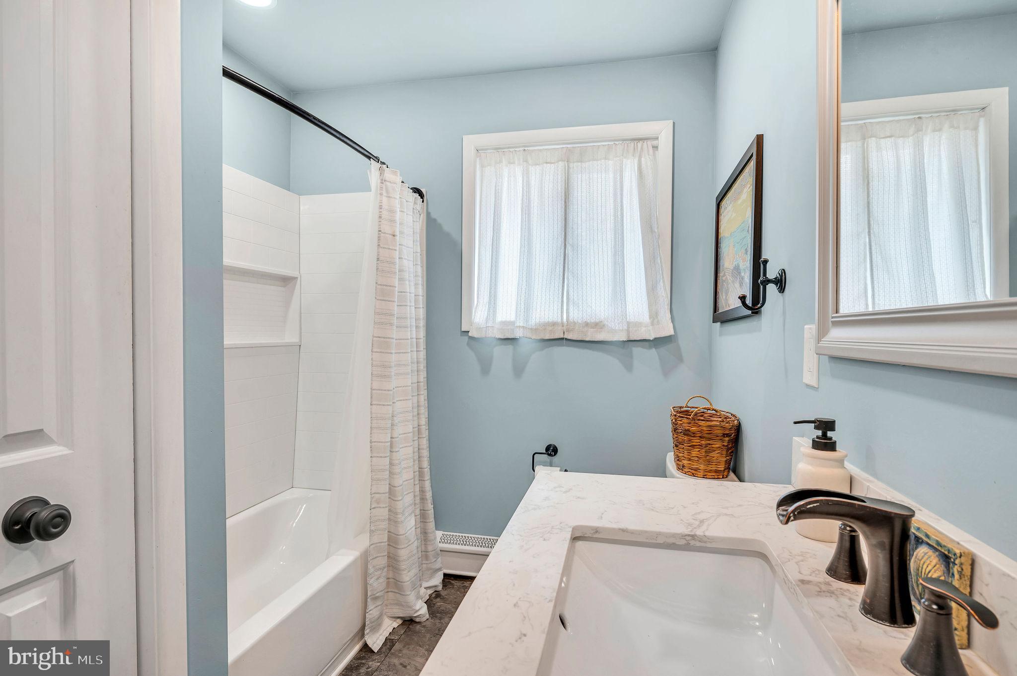 2707 Broder Street Southwest Allentown, PA 18103 - Photo 12 of 32 a bathroom with a tub and a sink