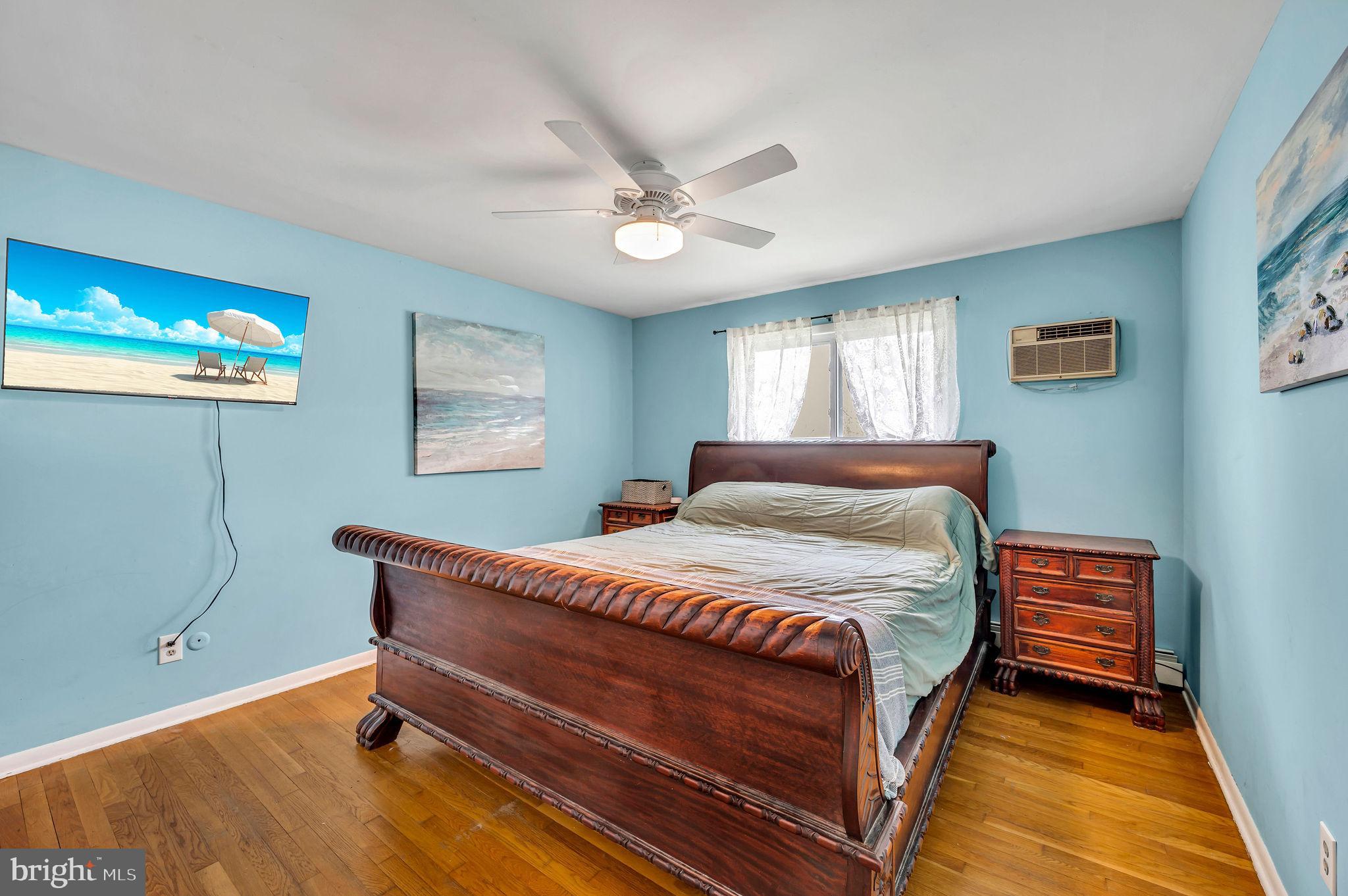 2707 Broder Street Southwest Allentown, PA 18103 - Photo 18 of 32 a bedroom with a bed and a chandelier