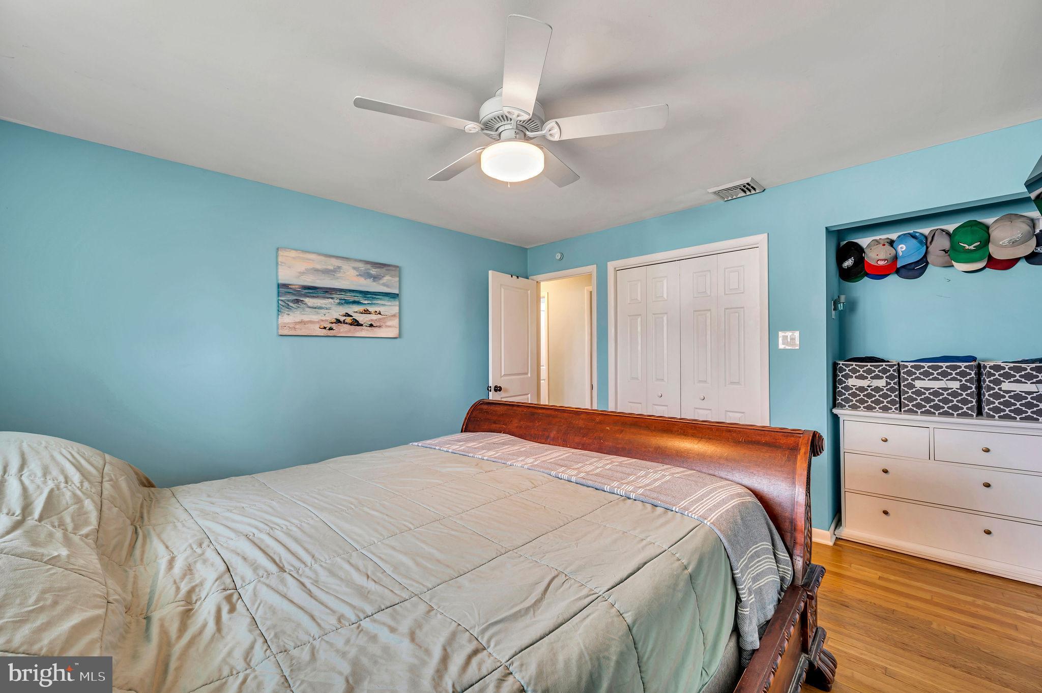 2707 Broder Street Southwest Allentown, PA 18103 - Photo 19 of 32 a bedroom with a large bed and a chandelier