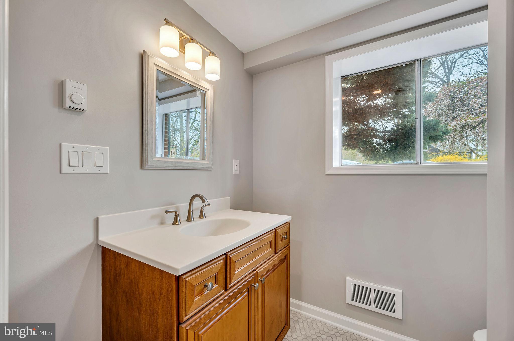 2707 Broder Street Southwest Allentown, PA 18103 - Photo 28 of 32 a utility room with a sink a vanity and a window