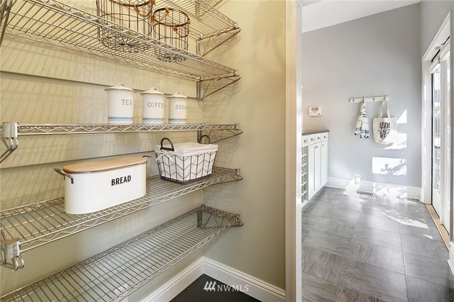 a view of a kitchen with appliances and cabinets