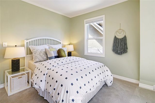 a bedroom with a bed and window