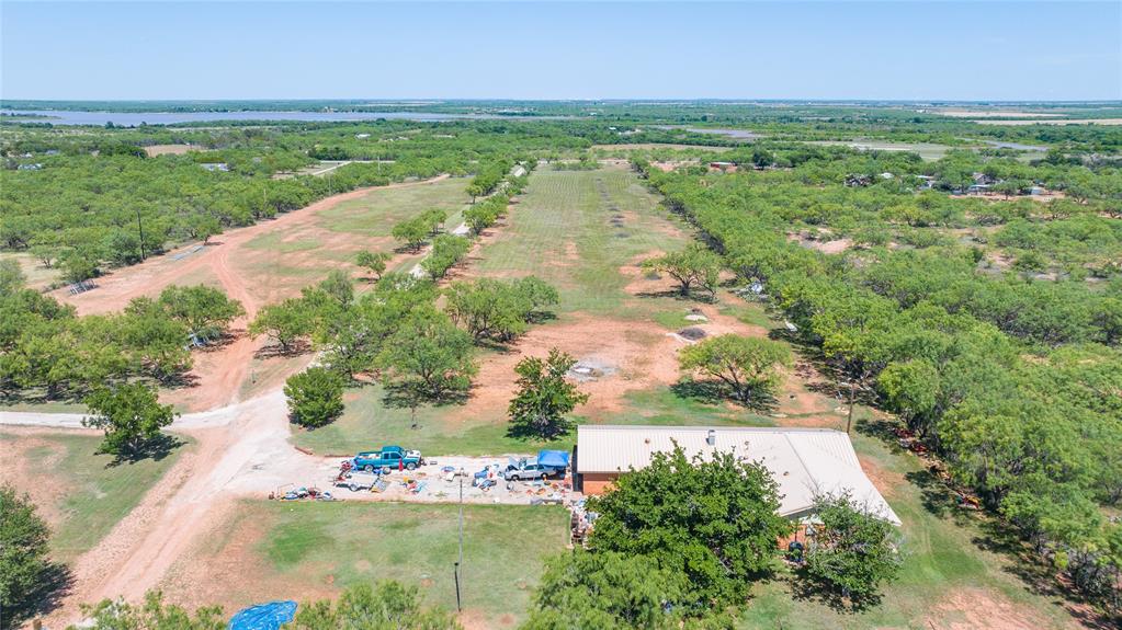6702 West Lake Road Abilene, TX 79601 - Photo 20 of 21 an aerial view of residential houses with outdoor space and trees all around