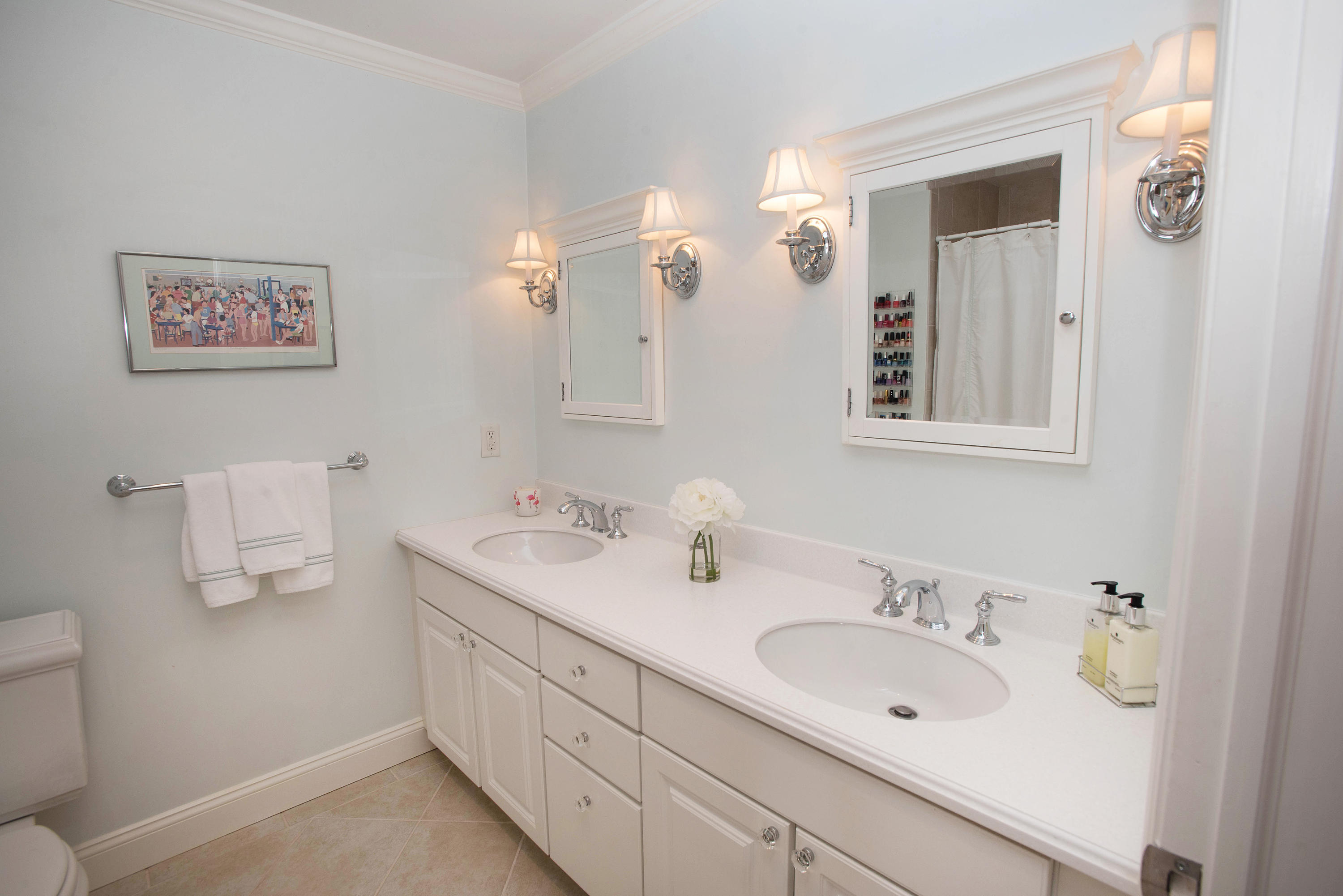 714 Ponus Ridge Road New Canaan, CT 06840 - Photo 36 of 57 a bathroom with a double vanity sink and a mirror