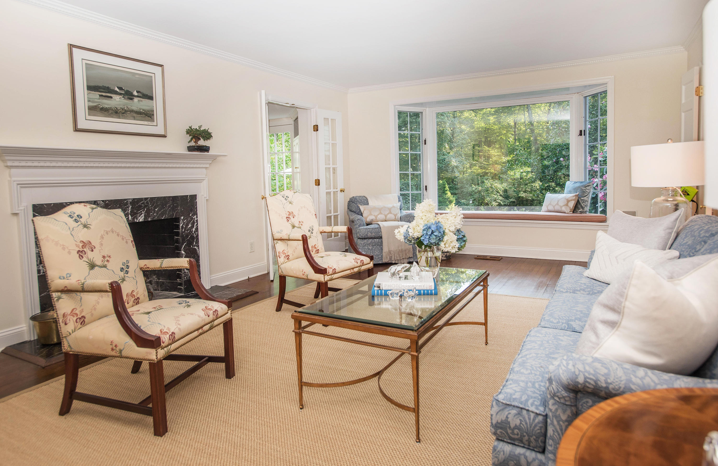 714 Ponus Ridge Road New Canaan, CT 06840 - Photo 5 of 57 a living room with furniture and a fireplace
