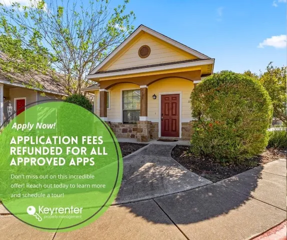a view of a white house with a swimming pool