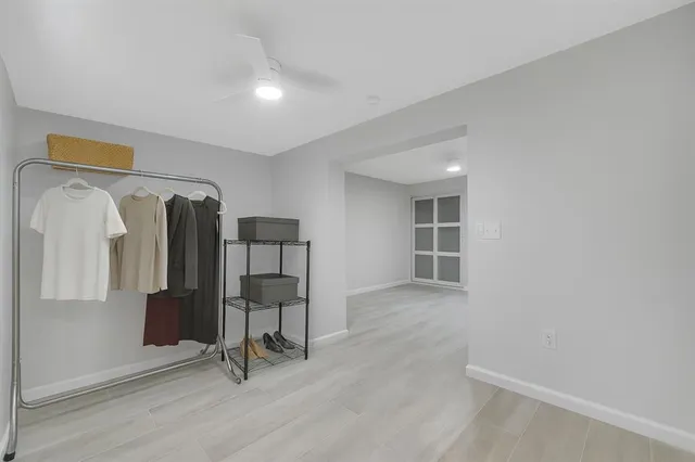 a view of workspace with wooden floor and windows