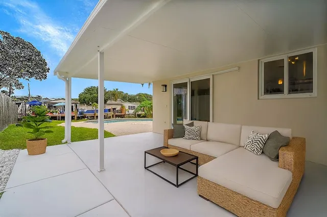 a living room with furniture and garden view