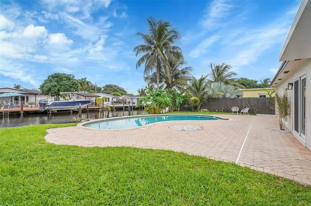 a view of a garden with a house