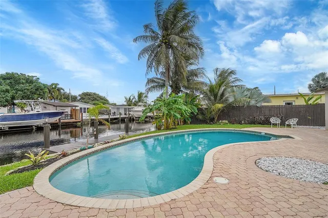 a view of a swimming pool with a lounge chair