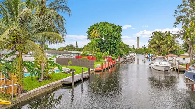 a view of swimming pool with outdoor seating and city view