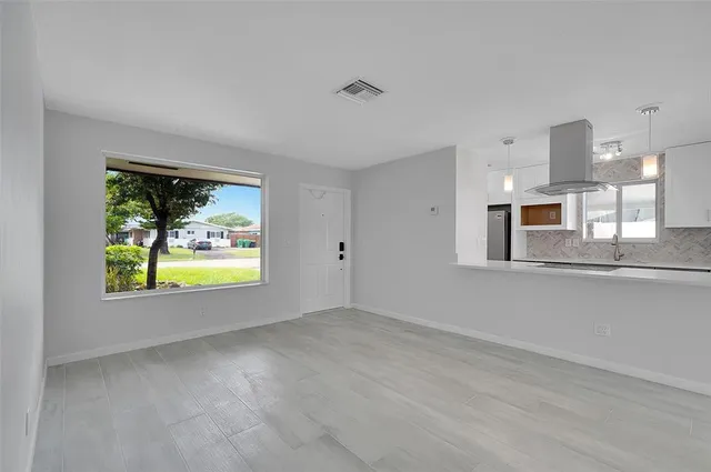 a view of an empty room with a window
