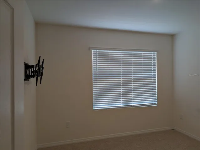 a view of a room that has a window in it