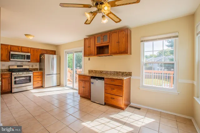 a view of a kitchen with a sink and dishwasher