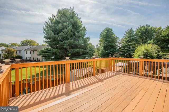 a balcony with trees in front of it