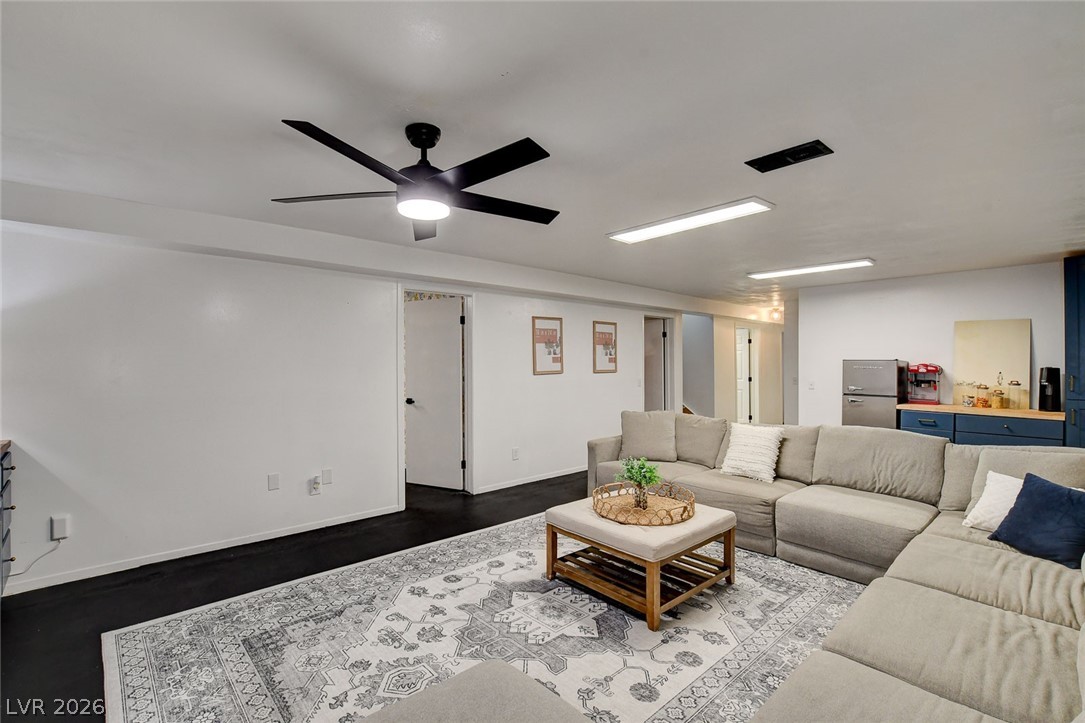 3765 Berkeley Street Logandale, NV 89021 - Photo 52 of 87 This family room features a ceiling fan, creating a comfortable and inviting atmosphere.