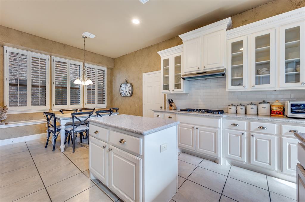 810 Redondo Irving, TX 75039 - Photo 13 of 24 Kitchen with white cabinets, pendant lighting, light tile patterned floors, and recessed lighting