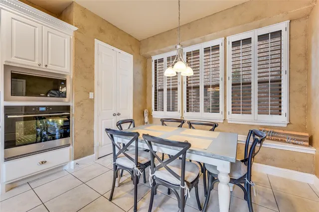 a view of a dining room with furniture and window