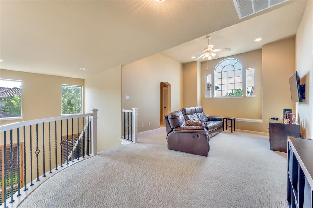 810 Redondo Irving, TX 75039 - Photo 16 of 24 Living area with recessed lighting, carpet, arched walkways, an upstairs landing, and ceiling fan