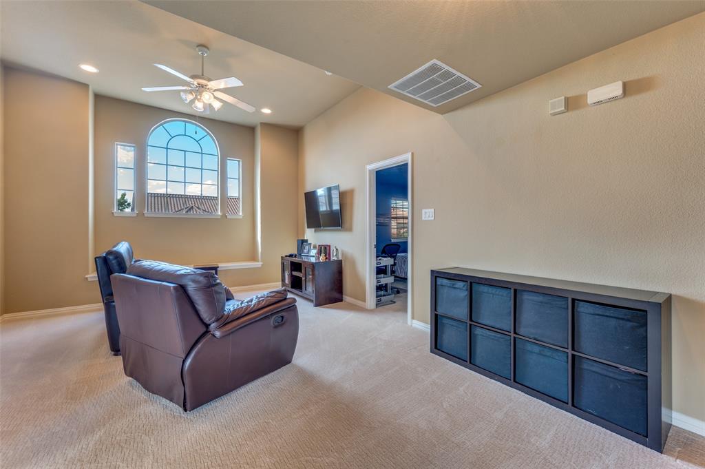 810 Redondo Irving, TX 75039 - Photo 17 of 24 Living area with carpet floors, recessed lighting, and ceiling fan