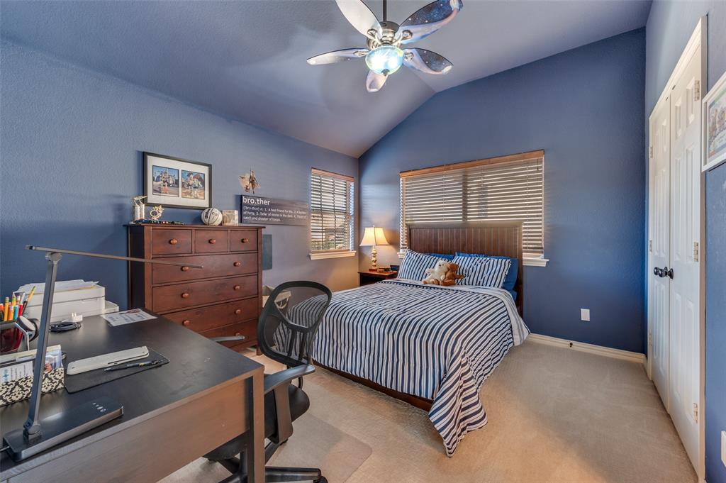 810 Redondo Irving, TX 75039 - Photo 20 of 24 Carpeted bedroom featuring vaulted ceiling, a closet, a ceiling fan, with access to Jack and Jill bathroom.