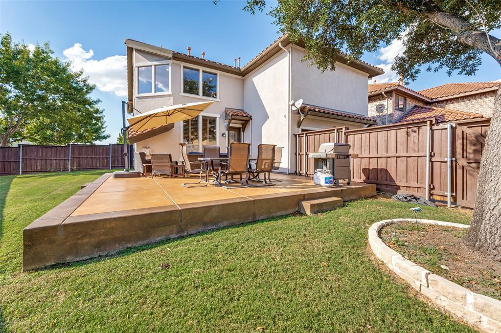 810 Redondo Irving, TX 75039 - Photo 24 of 24 Rear view of property with a fenced backyard, stucco siding, a tiled roof, and a patio