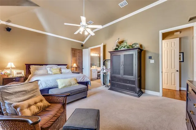 a bedroom with furniture and a chandelier